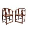 Discover this authentic pair of 19th-century Chinese horseshoe-back armchairs in solid elm wood, featuring carved longevity medallions. Available at Humble House Gallery, Canberra.