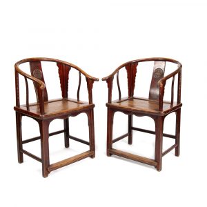 Discover this authentic pair of 19th-century Chinese horseshoe-back armchairs in solid elm wood, featuring carved longevity medallions. Available at Humble House Gallery, Canberra.
