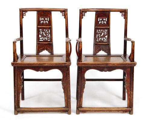 Discover this magnificent pair of 19th-century Chinese Southern Official's Hat armchairs in solid elm wood, featuring pierced openwork dragon carvings. Available at Humble House Gallery, Canberra.