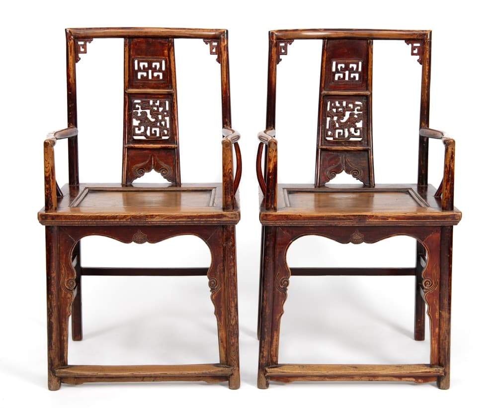 Discover this magnificent pair of 19th-century Chinese Southern Official's Hat armchairs in solid elm wood, featuring pierced openwork dragon carvings. Available at Humble House Gallery, Canberra.