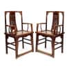 Pair of antique Chinese Southern Official Hat armchairs with intricate dragon carving. A prime example of classic Chinese antique furniture.