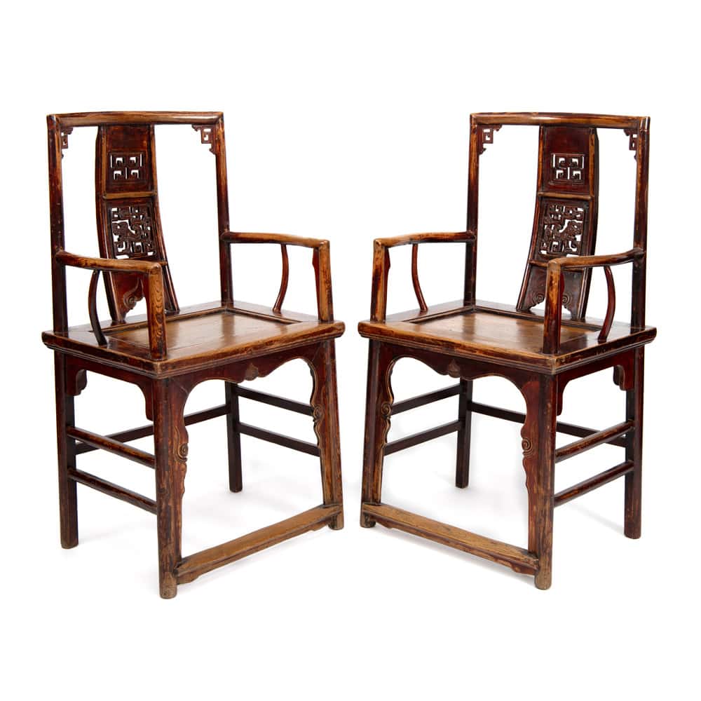 Pair of antique Chinese Southern Official Hat armchairs with intricate dragon carving. A prime example of classic Chinese antique furniture.