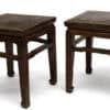 Pair of antique Chinese elmwood square stools with humpback stretchers, ideal for seating and side tables.